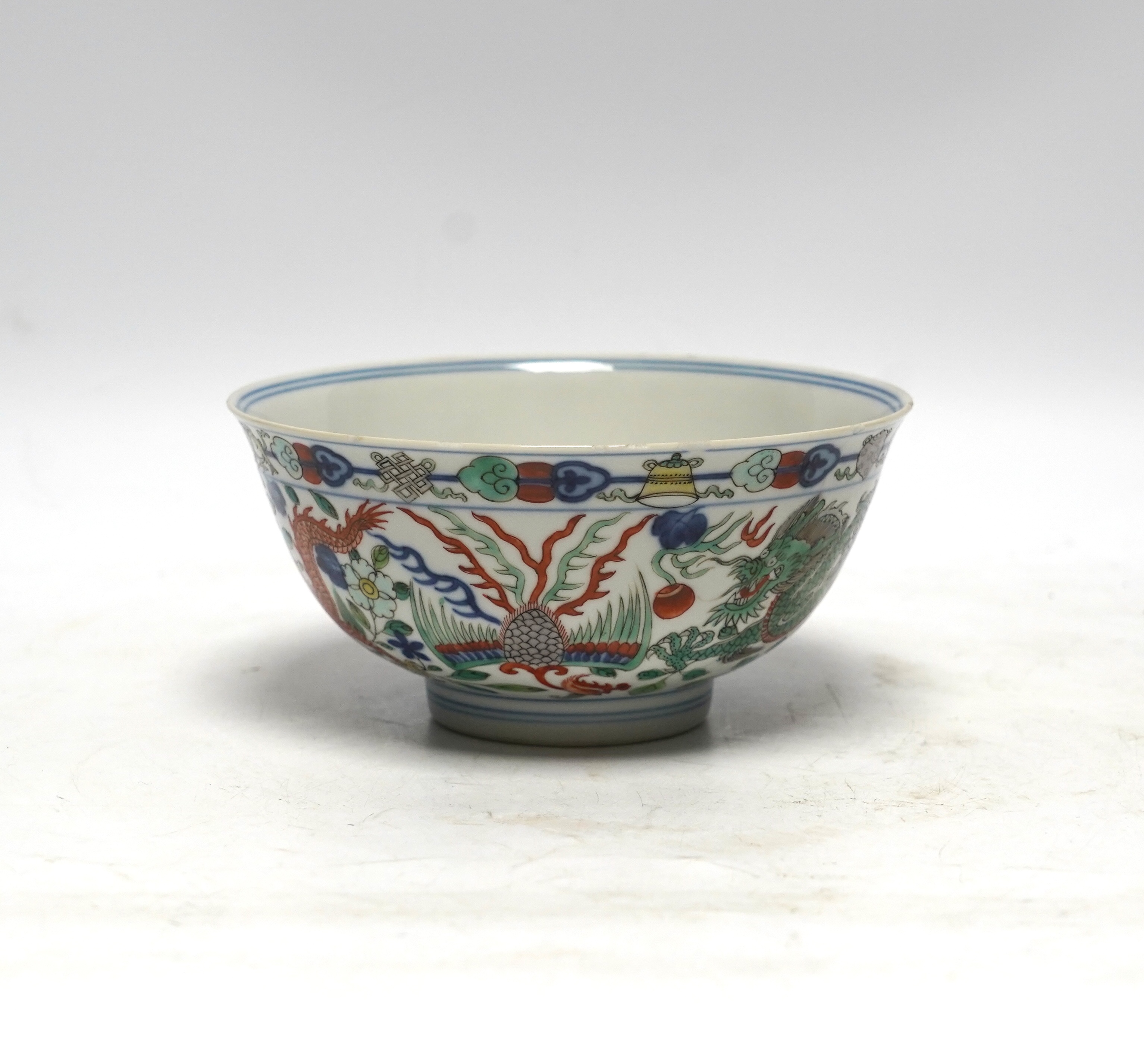 A Chinese wucai ‘dragon and phoenix’ bowl, early 20th century, diameter 15cm